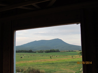 View of the mountains looking through a door at Cross Keys Barn during barn renovation.