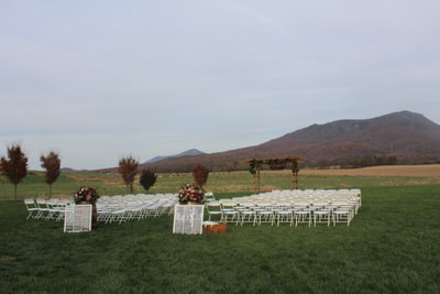 Outdoor fall ceremony site with mountain view at VA wedding venue.