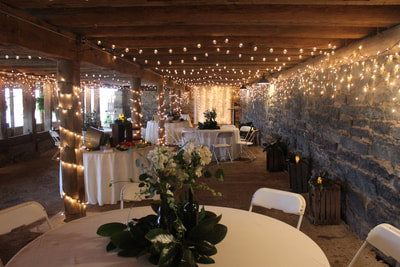 Cocktail area at barn wedding venue.